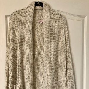 Cream colored waffle knit cardigan.